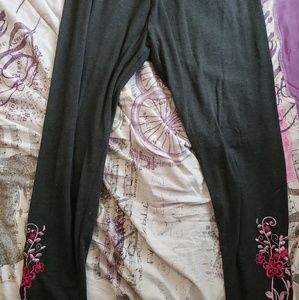 A pair of plus sized embroidered leggings
